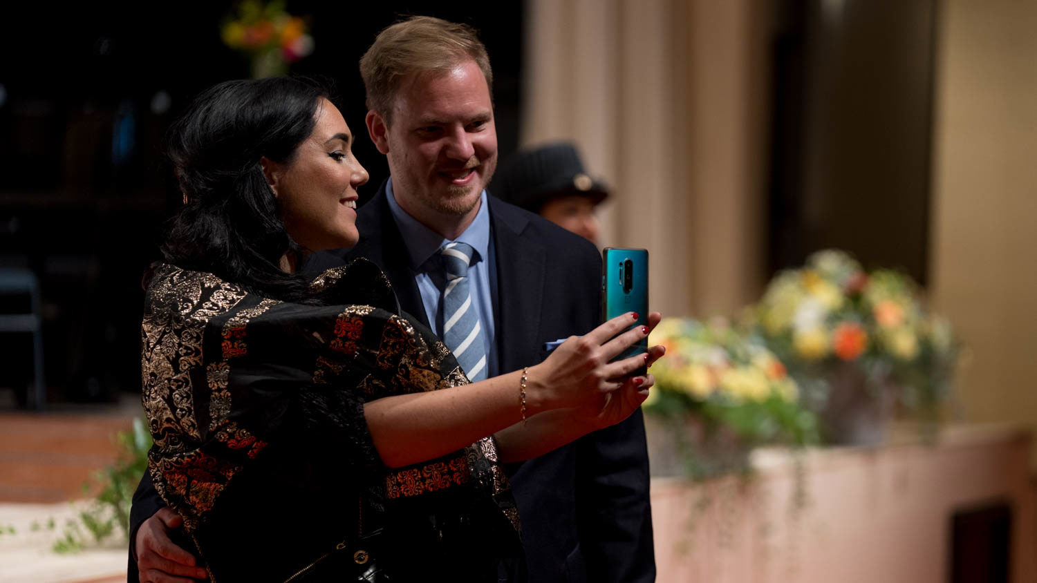 Guests taking selfies after the Academic Ceremony