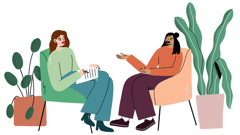 two people sitting in two armchairs