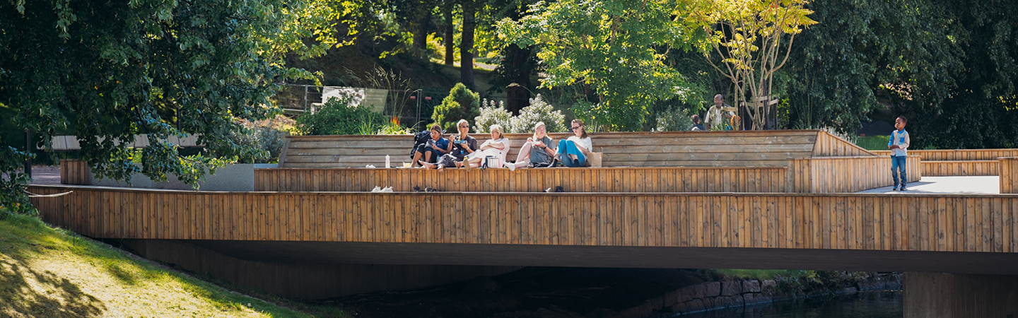 People sitting on a bridge